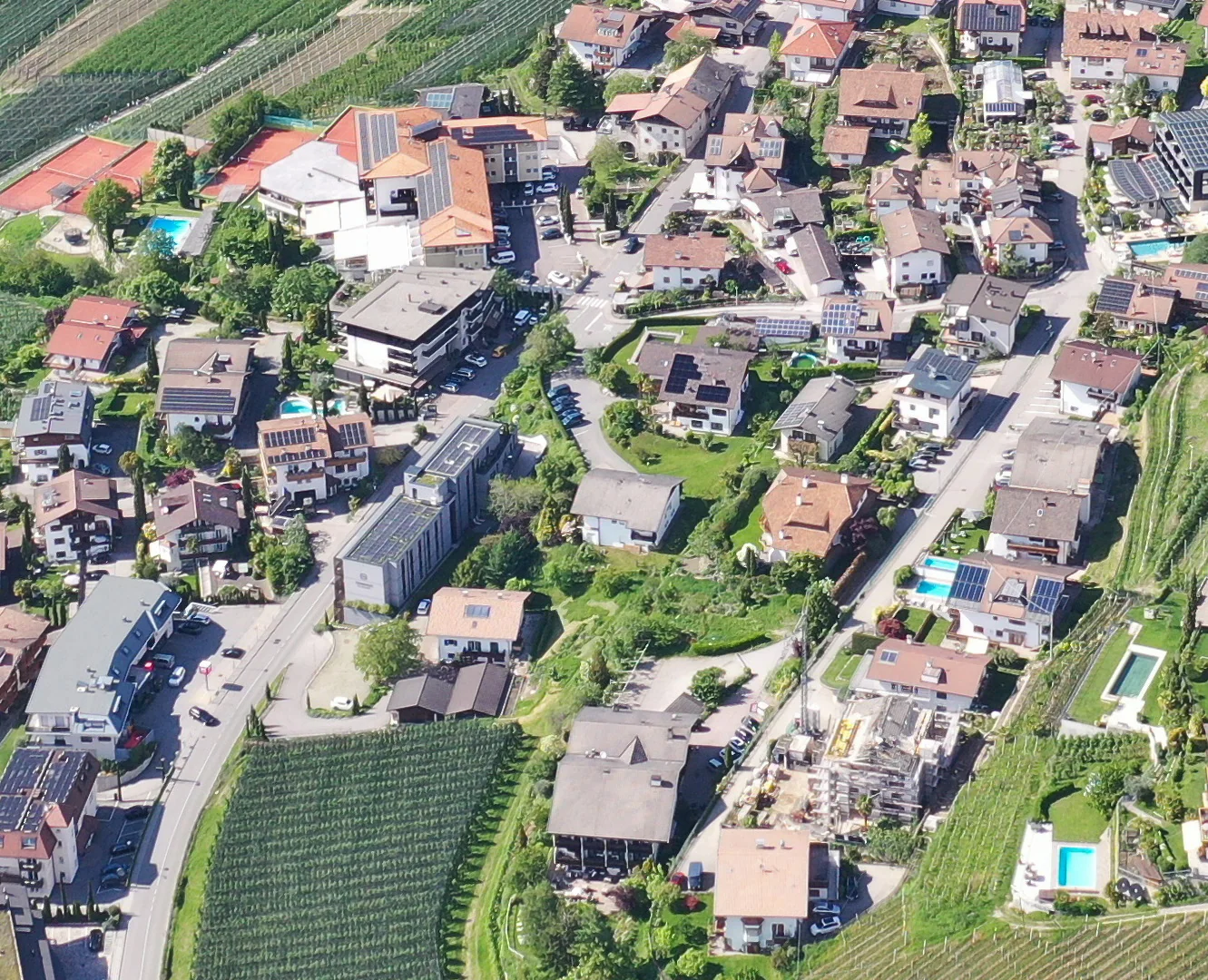 Aerial photograph of Schenna's existing built fabric, with open ground between houses identified for densification